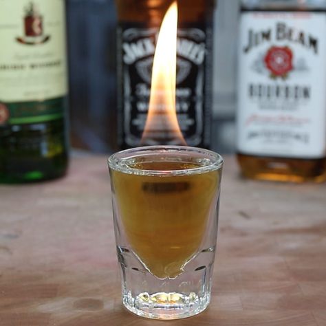 This Flaming 4 Horsemen of the Apocalypse Shot is downright devilish with real flames and dense whiskey potency. To make this super strong cocktail, mix Jack Daniel's Tennessee whiskey, Jim Beam Bourbon whiskey, Johnny Walker Black, Jameson Irish whiskey, and 151 proof rum. Seriously, we we say this is a strong whiskey shot, we mean it. Flaming Shots, 4 Horsemen Of The Apocalypse, Good Whiskey Drinks, Breakfast Shot, How To Make Vodka, Whiskey Drinks Recipes, Boozy Treats, Shooter Recipes, 4 Horsemen