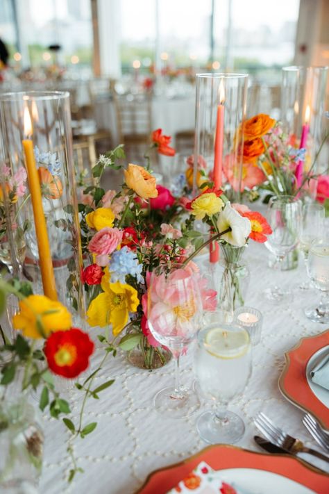 Get wisked away by these Amalfi Coast inspired florals. These sweet bud vases provide a pop of florals all along your reception tables. Colorful candles always add a touch of fun and playfulness! Oranges, yelows, and pinks with pops of blue and light greenery.
Jersey City florist Bright Wedding Palette, Colorful Flowers Wedding, Colorful Table Decor, Floral Tablescape, Wedding Reception Table Decorations, Table Arrangements Wedding, Liberty House, Wedding Table Flowers, Reception Tables