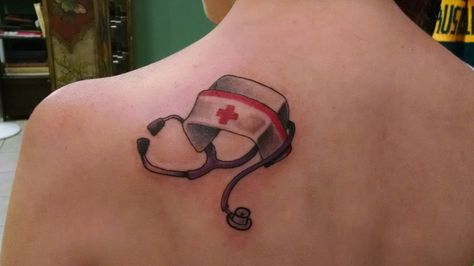 Tattoo by Envy Skin. I'm a nurse and always desired to have a nurses cap. I had him put a purple stethoscope because that is what I use daily. Love this tattoo Phlebotomist Tattoo, Purple Stethoscope, Graduation Tattoo, Nursing Tattoos, Stethoscope Tattoo, Tattoo Uk, Nurse Tattoo, Female Tattoos, Magic Tattoo