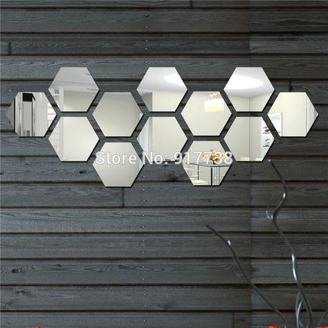 These look like some IKEA mirrors that are no longer available. Hexagon Mirror Wall Decor, Mirror Wall Decor Bedroom, Diy Mirror Wall, Hexagon Mirror, Diy Wall Decals, Elegant Interior Design, Mirror Design Wall, Mirror Wall Stickers, Wall Stickers Living Room