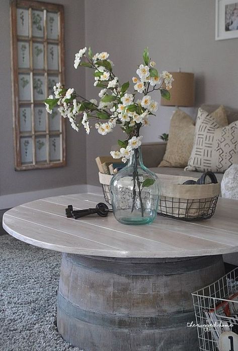 I saw this 1/2 wine barrel at a local nursery and I knew I had to turn it into a wine barrel coffee table. Sadly, I didn’t realize how bad the condition was prior to paying almost 100.00 for it. I immediately knew I had to make it into a wine barrel coffee table. I was envisioning this amazing farmhouse piece and while we were making it I just kept thinking “Is this actually going to turn out?“ Here’s the lovely 1/2 wine barrel after I gave it a GOOD sand down. I’m sure it could of… Wine Barrel Coffee Table, Christmas Tree In Basket, Farmhouse Projects, Barrel Coffee Table, Old Baskets, Loft Ideas, Craft Decor, Coffee Table Farmhouse, Pinterest Ideas