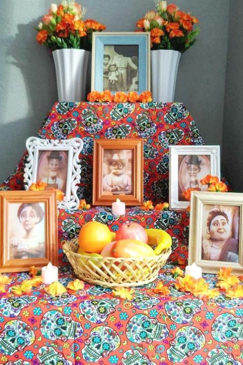 Disney Coco Altar | CatchMyParty.com | Party Decor Coco Ofrenda Pictures, Coco Altar, Coco Party Decorations, Coco Party Ideas, Coco Birthday Party Ideas, Coco Decorations, Coco Birthday Party, Dia De Los Muertos Party Ideas, Coco Photo