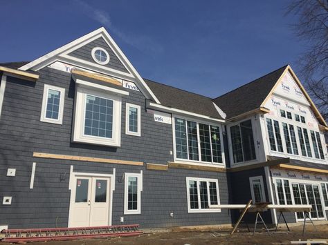 It’s vinyl shake siding and it’s made by Mastic, the color is Natural Slate. Lake House Siding, Natural Slate Siding, Mastic Vinyl Siding, Dark Grey Siding, House Siding Ideas, Vinyl Shake Siding, New House Construction, Lilypad Cottage, Siding Ideas