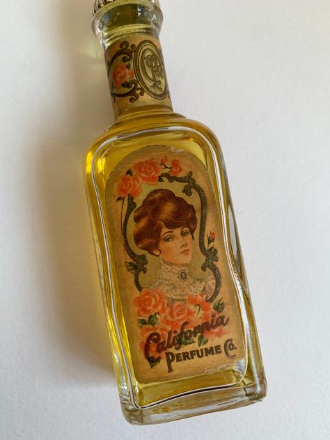 "This listing is for the vintage California Co Perfume Bottle for Avon's 90th Anniversary. This bottle is in good condition for its age, There are no chips or cracks and plenty perfume is left inside. The top has some general wear (the gold has worn away in areas). Bottle with cap measures 5 3/8\"T. Please take a look at photos, this is the actual bottle for sale. Please follow our shop link for more vintage, jewelry and art. https://www.etsy.com/shop/CandilandArt" Unique Perfume Bottles, Bambi Beauty, Retro Perfume, Avon Perfume Bottles, Avon Perfume, Lilac Blue, Hygiene Care, Fancy Makeup, Perfume Lover