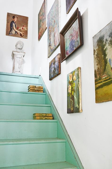 Green, Wall, Yellow, Room, Interior design, Stairs, Art, Visual arts, Collection, Art gallery, 1700s Farmhouse, Blue Staircase, Painted Stair Risers, White Stair Risers, Nancy Meyers Aesthetic, Spool Bed, Farmhouse Stairs, Framed Needlepoint, Bold Paint Colors