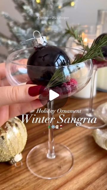 ChampagneAng | Ang Sturino on Instagram: "It’s timeeee!!🎄🍷✨ Make your drinks unforgettable this holiday season with this Winter Ornament Sangria! Imagine your guests pouring their own festive cocktail from an ornament – talk about a holiday aesthetic!   Recipe Highlights: 🎄 4oz red wine 🎄 1oz triple sec 🎄 0.5oz simple syrup 🎄 1oz cranberry juice 🎄 Frost frozen cranberries with sugar for a snowy effect 🎄 Fill a clear ornament with the sangria mix 🎄 Create a cranberry bed in your glass, top with the ornament, and finish with a rosemary sprig!  We’re just 51 days away from Christmas, and I’ll be sharing a new holiday recipe every day until then! 🎅🏼✨ Follow along so you don’t miss out on all the festive sips and treats coming your way!   #holidayrecipes #christmasrecipes #christmasr Ornament Drinks Holidays, Ornament Drinks, Ornament Cocktail, Sangria Mix, Winter Sangria, Holiday Sangria, Holiday Aesthetic, Winter Ornaments, Clear Ornaments