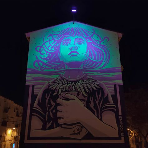 A photograph of a glow-in-the-dark mural at night, depicting a glowing image of a figure looking to the sky, clutching a potted plant to their chest. Dark Websites, Screen Print Poster, Colossal Art, Artist Collective, Visual Culture, Modern Crafts, Murals Street Art, Spanish Artists, Artist Websites