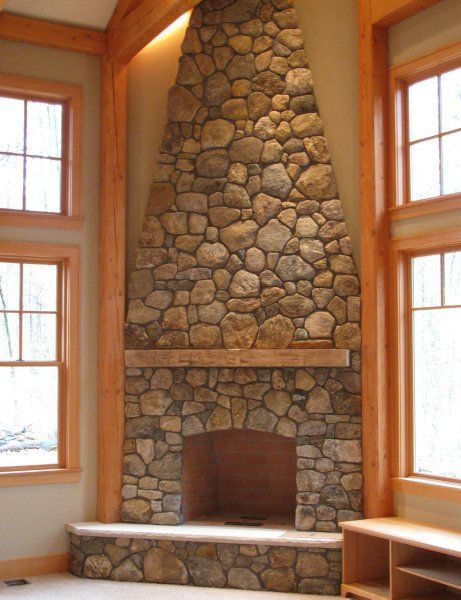 stone fireplace - tapers over the mantle Corner Fireplace Mantels, Corner Stone Fireplace, River Rock Fireplaces, Rock Fireplace, Tv Over Fireplace, Natural Stone Fireplaces, Round Building, Shiplap Fireplace, Small Fireplace