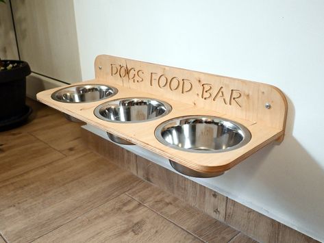 Wall Mounted Dog Bowls, Elevated Floating Dog Feeder, Raised Dog Feeding Stands // 1, 2 or 3 stainless steel bowls of 800ml / 27oz Wall mounted feeders allow you to choose the best height for your dog, thus providing a better position when eating to our pets, relieving the stress on their joints and spine. On top of that, they allow less playing with the food and messing the house, while you can easily vacuum beneath without the need to move the feeding stand. And if the design fits your interio Diy Dog Food And Water Bowl Stand, Dog Food Stand Diy, Dog Food Set Up, Dog Dish Ideas, Wall Mounted Dog Bowls, Mounted Dog Bowls, Dog Feeding Station Diy, Dog Feeding Area, Elevated Dog Bowls Diy