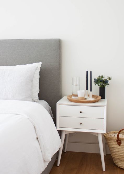 House Tour: A NYC Couple’s Minimalist Retreat | Apartment Therapy Nightstand Alternatives, White Nightstand Bedroom, Apartment Decorating For Couples, Apartment Ideas For Couples, Minimalist Nightstand, Stylish Bedroom Design, Trendy Apartment, Apartment Decoration, Прикроватные Тумбочки