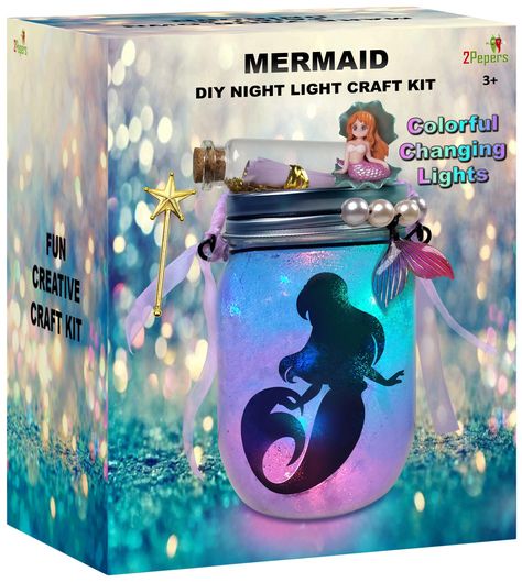 [SponsoredPost] This is an ideal craft project for young girls who are interested in mermaids. It is a fun and creative way to encourage imaginative play and has the potential to become a cherished keepsake. The project is suitable for girls ages 4 to 10, and it encourages them to use their skills to create something unique and special. The end result is a beautiful night light lantern jar that is sure to be a hit with any mermaid-loving girl. #kidstoysforgirlsage7-8-9-10 Mermaid Lantern, Little Mermaid Crafts, Lantern Jar, Mermaid Craft, Mermaid Garden, Lantern Diy, Kids Birthday Presents, Fairy Kit, Diy Mermaid