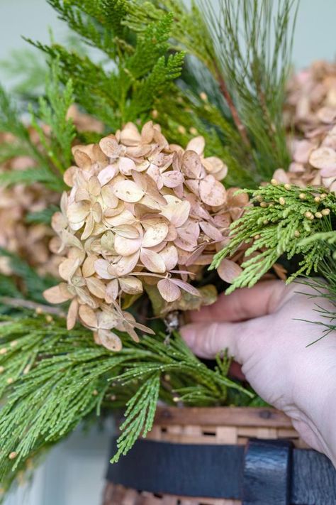 How to Create a Wintry Front Door Basket for Christmas | HGTV Front Door Basket Ideas, Winter Planters Front Porches, Christmas Door Basket, Potted Evergreens, Evergreen Planters, Winter Wreaths For Front Door, Front Door Basket, Door Baskets, Decor After Christmas