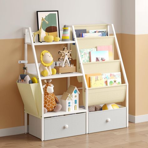 PRICES MAY VARY. [Easy to Assemble 2-in-1 Design]: This space-saving kids bookshelf features 3-tier book storage sling pockets and 3-tier wooden toy storage providing multiple organization options. The book storage bag displays books with front covers and is the perfect height for toddlers and children to easily identify and access. Dimensions: 32.8 x 11.80 x 29.5 inches. [Versatile Kids Bookshelf]: This bookshelf for kids works in any space. It helps keep your little one’s books and toys neat a Bookcase Toy Storage, Bookshelf And Toy Storage, Toddler Bookshelf, Baby Bookshelf, Book Sling, Bookshelf For Kids, Montessori Bookshelf, Toy Storage Organizer, Kids Bookshelf