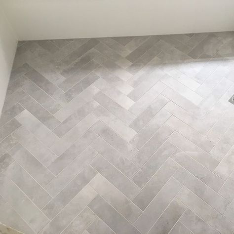 Teranova Grey Herringbone Floor Bathroom, Dark Herringbone Bathroom Floor, Marble Tile Half Way Up Bathroom Wall, Entry Hall Flooring Ideas, Grey Herringbone Tile Bathroom Floor, Mosaic Tile Floor Entrance, Herringbone Tile Floor Laundry Room, Gray Herringbone Tile Floor Bathroom, Grey Floor Tile Bathroom