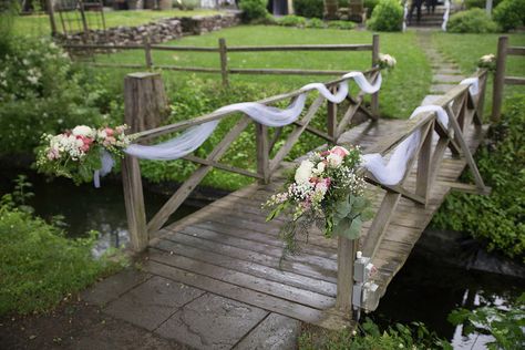 Lovely white tulle with beautiful bouquets of fresh flowers gracefully drapes the bridge at The Inn at Millrace Pond. Designed by Bilancia Designs for Renee & Rajeev's wedding/Lauren Dehrone Photography Bridge Decorations Ideas, Bridge Wedding Ceremony, Riverside Wedding Decorations, Bridge Flowers Wedding, Wedding On A Bridge, Decorating A Bridge For A Wedding, Wedding Pond Decorations, Outdoor Wedding Railing Decor, Decorating A Fence For A Wedding