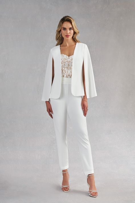 Surprise your guests with how modern you are by wearing our three-piece bridal pant suit, Tiffany. This style is made from stretch crepe, lace, and stretch satin. Her jacket is stylized with a cape instead of sleeves, the pants are high-waisted while the sweetheart bustier is drop-waisted to give a contoured look. The ankle length pants are a play on the tuxedo pant with a cummerbund waistband. Female Wedding Suit, Officiant Attire, Bridal Pant, Modern Elegant Wedding Dress, Lesbian Wedding Outfits, Bridal Pant Suit, Wedding Suit Women, Jumpsuit Modern, Bridal Pantsuit