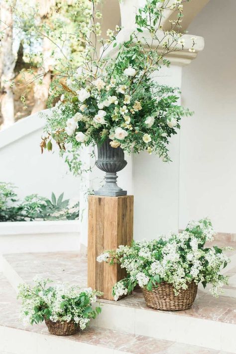 Wedding Urns Flowers, Low Wedding Ceremony Flowers, Mantle Decorating Ideas For Wedding, Pillar Flowers Wedding Ceremony, Flowers On Pillars, Flower Pillars Wedding, Wedding Urns, Flower Pillars, Greenery Wedding Ceremony