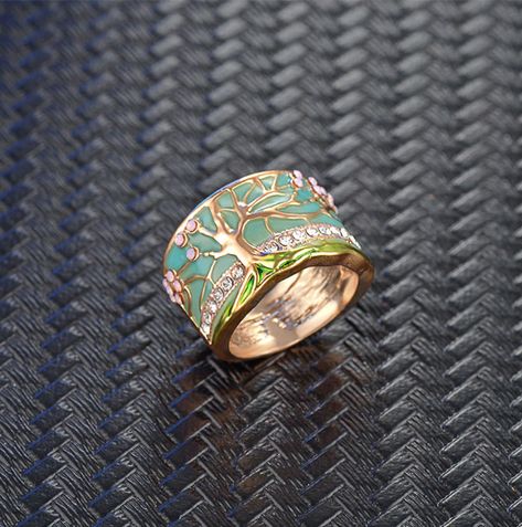 #the #World #of #Treasures #the #Exploring #Allure #Exploring #of #of #Gemstone #Unveiling #Jewelry #Natures #Beauty Tree Of Life Ring, Flowering Tree, Rings Metal, Sunflower Ring, Tree Rings, Wide Rings, Finger Rings, Chic Jewelry, Green Enamel