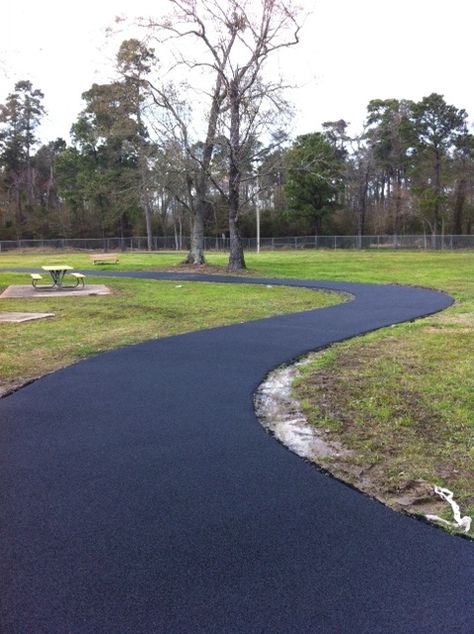 Looking for a great way to get in shape? Walking or jogging around an outdoor or indoor track can be a fun way to become physically fit. No Fault’s Multi-Purpose Rubber Surface provides the same slip-resistant, safe surface that you’ve come to know and love on the playground. It can be installed for running, walking and jogging tracks, and also for court yard or walkway areas. Walking Track In Garden, Backyard Walking Trail, Backyard Running Track, Diy Walking Trail, Walking Trails Backyard, Tennis Court Backyard, Neighborhood Activities, Trail Ideas, Court Yard