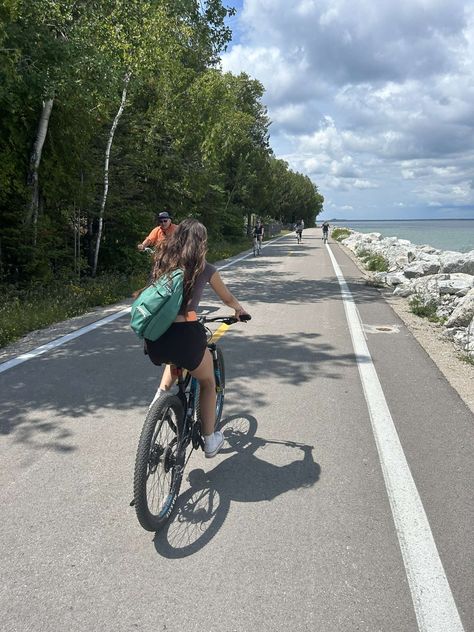 summer bike ride, brown shirt, denim shorts, backpack Mackinac Island Photo Ideas, Mackinac Island Picture Ideas, Mackinac Island Aesthetic, Macinak Island Michigan, Michigan Aesthetic, Summer Photo Inspiration, Mackinaw Island, 2025 Board, Mackinac Island Michigan