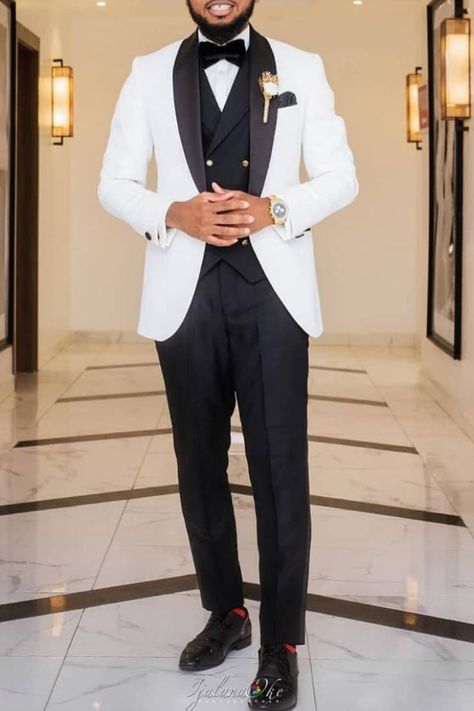 This is a White on black tuxedo suit which, perfect for any man's wedding style. A suit like this could be worn as a groom's wedding outfit or any night event for dapper men. If you would like a suit like this custom made for you, book an appointment online with us at Giorgenti New York! White Black Tuxedo Wedding, Black And White Tuxedo For Men Wedding, Wedding Suits Men White And Black, Black And White Wedding Tuxedo, Stylish Groom Suit, Black And White Prom Suit, White And Black Tuxedo Wedding, Black And White Suit For Men, White Tuxedo For Men Wedding