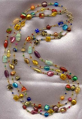 Three strands of Multicolored, Assorted Venetian Glass Beads on a 30-31 Inch, custom made necklace. This is our own Alexander-Lee Gallery design. Each handmade bead is made one-by-one, under the flame, using world famous Murano Glass; these beautiful beads are made with 24 Karat yellow gold foil, white gold foil, pure silver foil, aventurina (copper filings), swirls of colors, millefiori, and much more. Necklace is accented with gold foil seed beads, and gold filled toggle clasp. Micro Bead Necklace, Murano Beads Necklace, Venetian Glass Beads, Murano Necklace, Multi Layer Necklace Beads, Dope Jewelry Accessories, Braided Bracelet Diy, Murano Glass Necklaces, Beaded Jewelry Necklaces