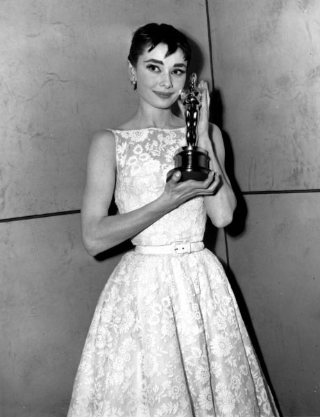 Historic Oscars Red Carpet Style | POPSUGAR Fashion Audrey Hepburn at the 1954 Academy Awards  Audrey Hepburn in Givenchy, 1954 Audrey Hepburn Oscar, Audrey Hepburn Givenchy, Best Oscar Dresses Of All Time, Audrey Hepburn Outfit, Vestidos Oscar, Best Oscar Dresses, Audrey Hepburn Roman Holiday, Oscar Gowns, Best Actress Oscar