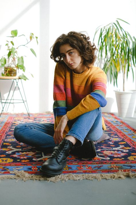 Bored woman sitting in light room on floor · Free Stock Photo Bored Women, Sitting Pose Reference, Sitting On Floor, Striped Knitted Sweater, Vibrant Rugs, Fall Wardrobe Essentials, Sitting Poses, Pose Reference Photo, Elevate Your Home