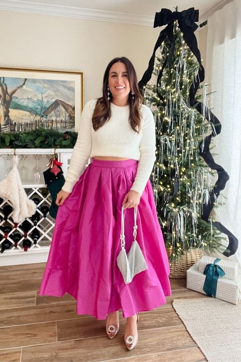 Obsessed with this look for the holidays! If you’re on the hunt for the perfect Christmas outfit, look no further than this showstopping pink skirt. Definitely a party staple. This special stunning skirt will turn heads wherever you go. Rock it with a cozy white sweater, some adorable shoes, and a sparkling purse for an aesthetic holiday look. Follow me for more outfit ideas for women. Holland Paterno. Christmas Outfit Pink Skirt Outfit Winter, Pink Skirt Outfit Ideas, Pink Christmas Outfit, Cozy White Sweater, Festive Christmas Outfit, Pink Skirt Outfits, Aesthetic Holiday, Christmas Outfit Ideas, Trendy Christmas Outfits