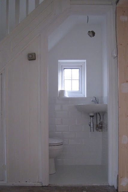 Powder Room Under The Stairs | Content in a Cottage Small Windows Ideas, Small Basement Windows, Understairs Toilet, Stairs Bathroom, Tiny Powder Rooms, Room Under Stairs, Bathroom Under Stairs, تحت الدرج, Bilik Air