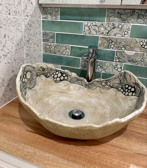 Image of a timber vanity top, with handmade, oval wavy edged ceramic basin. The basin has greenish grey blue organic linework design hand painted around the inner top edge. The tiles behind are rectangular subway style, with turquoise Italian tiles mixed with hand painted artist tiles in similar colours. They are painted in a similar design to the sink, in organic ocean inspired linework designs. The wall tiles to the left are white terrazzo. Ceramic Basin Sink, Ceramic Basin Handmade, Handmade Sink Ceramic, Ceramic Sink Bowl, Bathroom Basin Ideas, Handmade Tiles Bathroom, Pottery Sink, Ceramic Sink Bathroom, Clay Sinks