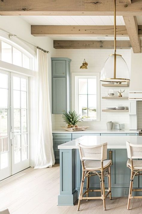 Discover a world of coastal farmhouse kitchen inspiration with over 30 ideas, including functional islands, chic cabinets, and atmospheric lighting. Embrace the tranquility of coastal colors and farmhouse design in your kitchen decor. Small Coastal Kitchen, Coastal Cottage Kitchen, Farmhouse Kitchen Designs, Modern Coastal Kitchen, Townhouse Kitchen, Modern Coastal Farmhouse, Coastal Kitchen Ideas, Lakehouse Kitchen, Retirement Goals