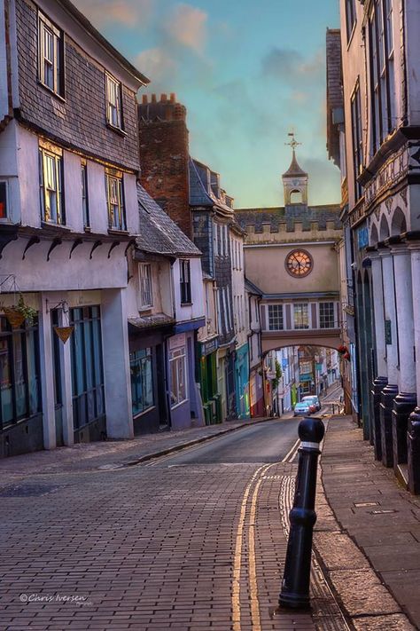 "Standing on the High Street, looking towards the East Gate, the early morning light casts its warm tones upon the historical town of Totnes, Devon". Text and picture by Chris Iverson Photography. Oxford England, Devon Uk, Cottage Grove, Uk Holidays, Devon England, Scotland Highlands, Cornwall England, Yorkshire Dales, Yorkshire England