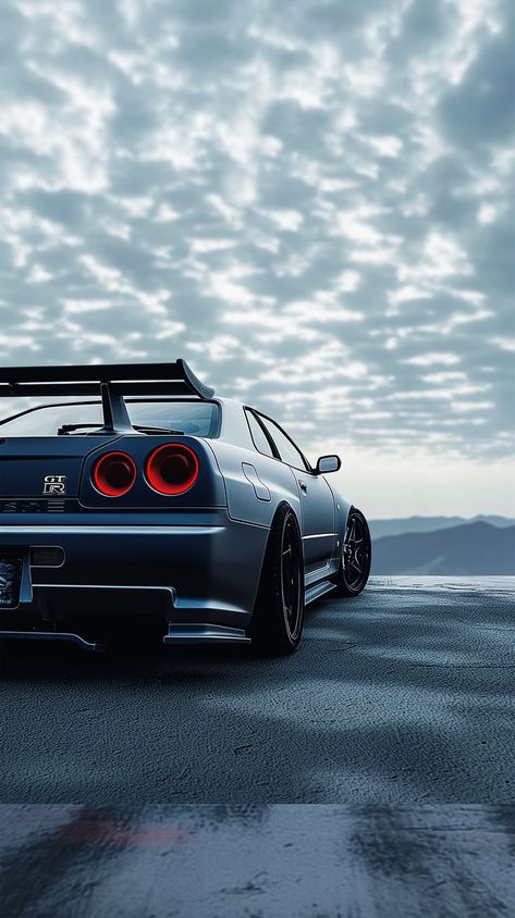 Dark GTR car wallpaper - Unleash the power and intensity of the GTR on your screen with this dark car wallpaper. Experience the sleek design and thrilling vibes. #GTR #CarWallpaper #DarkMode #IntenseVibes Japan Car Wallpaper, Gtr Car Wallpaper, Nissan Skyline Gtr R34 Wallpapers, Gtr R34 Skyline Wallpaper 4k, Anime Cars, Nissan R34, R34 Skyline, Gtr Car, Skyline Gtr R34