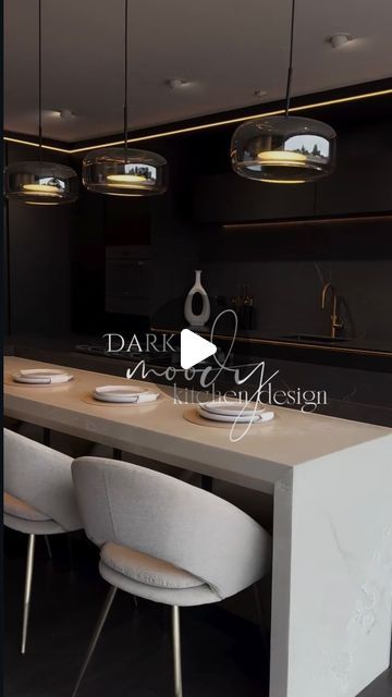 A E S T H E T I C A L L Y 💡✨ on Instagram: "Dark & moody kitchen design. 🌑✨

.

[SAVE FOR LATER!]

.

Featuring sleek black cabinets and cupboards, paired with a lighter tone countertop built into the eat-in island👇

Tips to Achieve the Look:

✨ Contrast with Warm Lighting: Use pendant lights, under-cabinet lighting, and dimmable fixtures to add warmth and depth to the dark palette.

✨ Incorporate contrasting furniture: Balance the dark tones with lighter materials like the white countertop and chairs to add more balance.

✨ Add Metallic Accents: Use brass to tie the warm tone to the veining of the dark marble,  this will add a touch of luxury and break up the dark colors.

What’s your favorite feature?!

👉SUSCRIBE TO CHANNEL FOR MORE EXCLUSIVE DETAILS AND SALE ALERTS 🚨 📐
.
.
.

Via: Moody Kitchen, Under Cabinet, Under Cabinet Lighting, White Countertops, Cabinet Lighting, Black Cabinets, Metallic Accents, Dark Colors, Kitchen And Bath