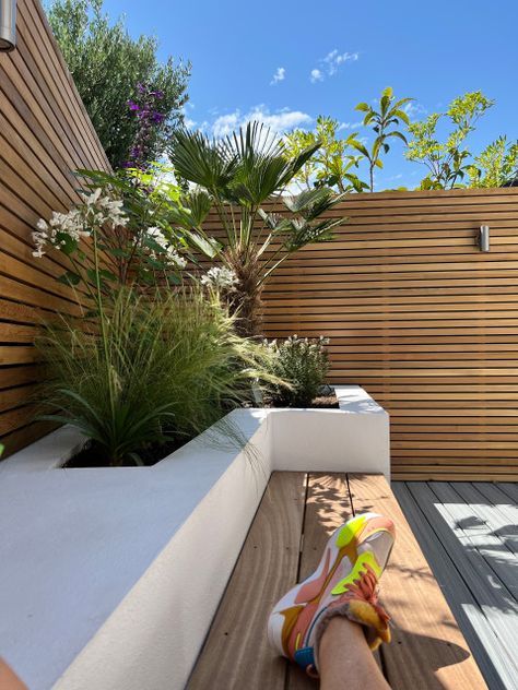 Tiny courtyard with raised bed and bench in Barnes Raised Bed With Seating, Garden Wall Bench, Raised Bed With Bench, Raised Planter Boxes Along Fence With Seating, Sleeper Raised Beds With Seating, Concrete Sleeper Garden Bed, Tiny Courtyard Garden, Bed And Bench, Tiny Courtyard