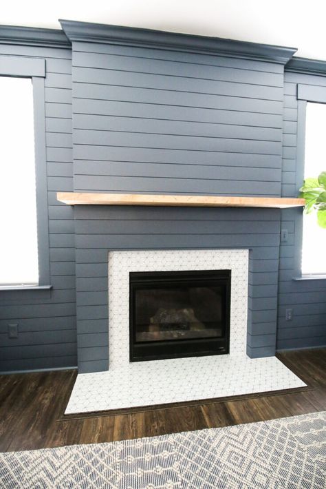 This started out as a flat gas fireplace insert with a traditional mantle and surround, and now it's a modern farmhouse beauty.Building a frame to bump out the fireplace gives it more presence in the room, turning it into the focal point of the space without having to spend a lot of money to do it. Love the addition of the ceramic tile around the insert and on the hearth too. The tile and color of the shiplap along with the fireplace mantle give this fireplace remodel a lovely coastal vibe. Diy Shiplap Fireplace, Painting Shiplap, Granite Fireplace, Fireplace Update, Shiplap Accent Wall, Build A Fireplace, White Shiplap Wall, Shiplap Fireplace, Diy Shiplap