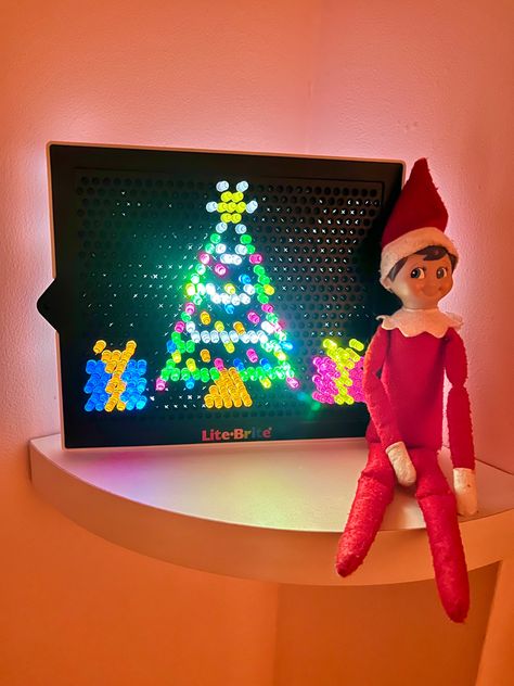 Elf On The Shelf Lego Christmas Tree, Lite Brite Elf On The Shelf, Elf On The Shelf With Lights, Elf On The Shelf Wrapped In Lights, Elf On The Shelf Glow Sticks, Elf On Shelf Lego Ideas, Elf On The Shelf Ideas Magnatiles, Elf On The Shelf Lite Brite, Bluey Elf On The Shelf