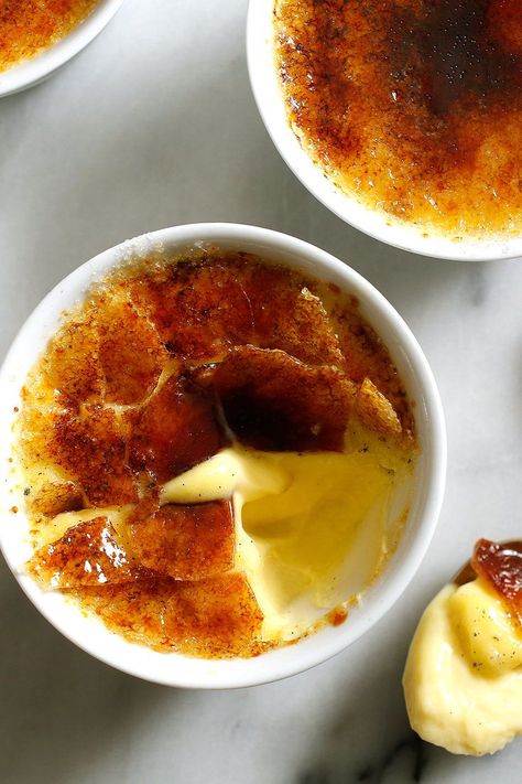 NYT Cooking: Five simple ingredients – cream, vanilla, salt, eggs and sugar – make for an exquisitely rich and elegant dessert. Most crème brûlée recipes require the use of a small propane torch to achieve the crackly sugar top, but this version offers a simpler (and safer) solution: your oven's broiler. One thing to note: Be sure to let the custard set for several hours in the%2... Crème Brûlée Recipe, Propane Torch, Patisserie Fine, Brulee Recipe, Creme Brulee Recipe, Best Thanksgiving Recipes, Slow Cooker Desserts, Elegant Desserts, Minimalist Baby