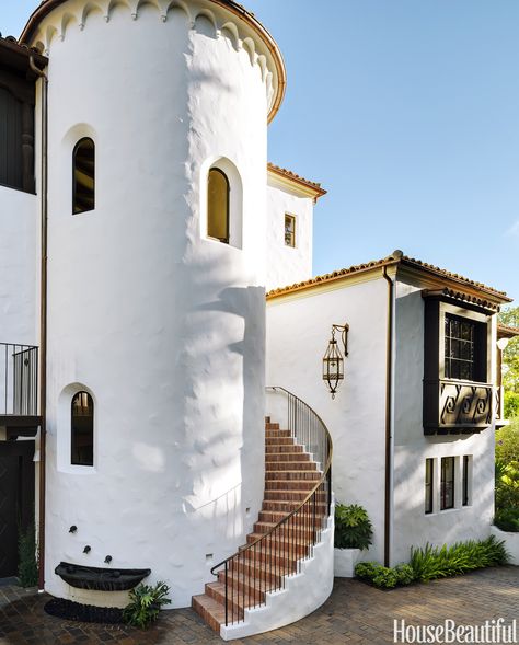 An exterior circular staircase leads to the front door, and the tower holds an interior circular staircase. The bronze fountain is by sculptor Simon Toparovsky.   - HouseBeautiful.com California Hacienda, Monterey Style, Circular Staircase, Spanish Colonial Homes, Home Styles Exterior, Colonial Design, Spanish Architecture, Spanish Style Home, Casas Coloniales