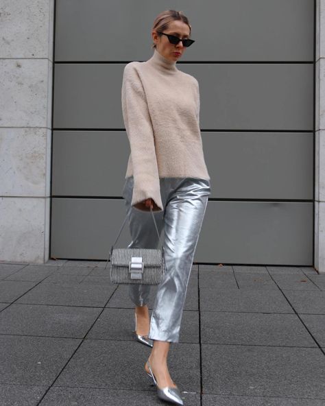 13 Amazing Silver Outfit Ideas Perfect For a Party - The Wandering Girl How To Wear Silver Pants, Silver Jeans Outfit 2023, How To Style Metallic Pants, Silver Jeans Outfit Casual Styles, Silver Leather Pants Outfit, Silver Pants Outfit Night, Silver Metallic Pants Outfit, Silver Outfit Ideas, Silver Jeans Outfit