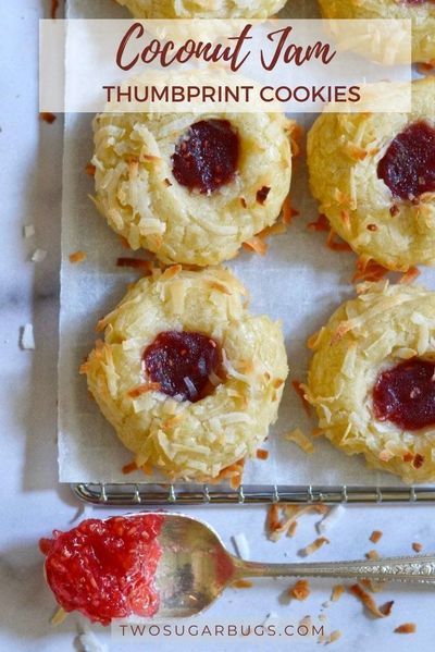 This buttery shortbread cookie recipe is coated in shredded coconut, filled with jam and baked to create an addicting thumbprint cookie. Made with only 8 ingredients ~ these cookies are always a hit with friends and family. ~ Recipe on twosugarbugs.com #cookies #jamcookies #shortbread #thumbprintcookies #coconutcookies Thumbprint Cookie, Coconut Jam, Coconut Cookies Recipes, Jam Thumbprint Cookies, Thumbprint Cookies Recipe, Buttery Shortbread Cookies, Buttery Shortbread, Jam Cookies, Shortbread Cookie Recipe