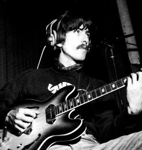 George Harrison wearing his “Stamp Out The Beatles” sweater during a recording session for Sgt. Pepper’s Lonely Hearts Club Band in early 1967 Epiphone Sheraton, Beatles George Harrison, Beatles George, Lizard King, Bug Boy, Beatles Pictures, Instant Karma, Paul George, The Fab Four