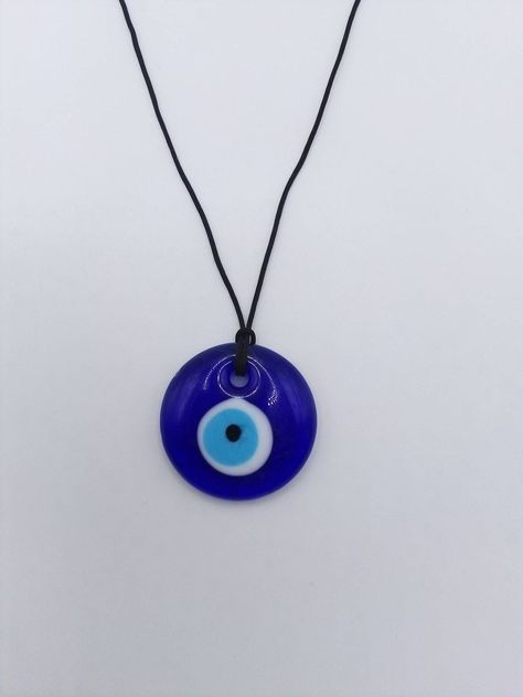 Evil Eye Pendant Amulet Necklace, Evil Eye Amulet Pendant Necklace, Traditional Glass Necklace For Gift, Blue Evil Eye Jewelry For Meditation, Blue Amulet Necklace For Good Luck, Blue Round Pendant Necklace For Good Luck, Spiritual Evil Eye Round Necklace, Spiritual Evil Eye Necklace, Symbolic Blue Necklace With Round Pendant