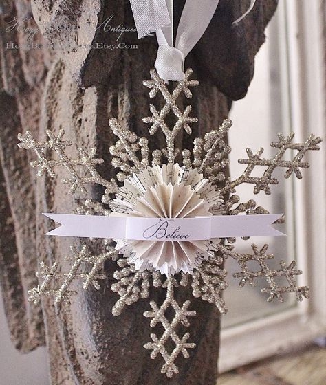 Christmas BELIEVE Glitter Snowflake Ornament LARGE Home Décor Sign or Package Adornment Vintage in Style, this fabulous aged silver toned glittery snowflake ornament adds a vintage shabby chic flair to your Holiday Décor! Measures  7" x 6" Double stacked Paper Rosettes with a Banner that reads "Believe" Vintage Seam Binding tie at top finishes off this sweet handmade ornament. Could also be used as a package embellishment!  Need More? We are happy to accommodate your request! Please convo us with any questions. Christmas Snowflakes Ornaments, Paper Rosettes, Shabby Christmas, French Christmas, Christmas In July Sale, Shabby Chic Christmas, Navidad Diy, Chic Christmas, Christmas Gift Decorations