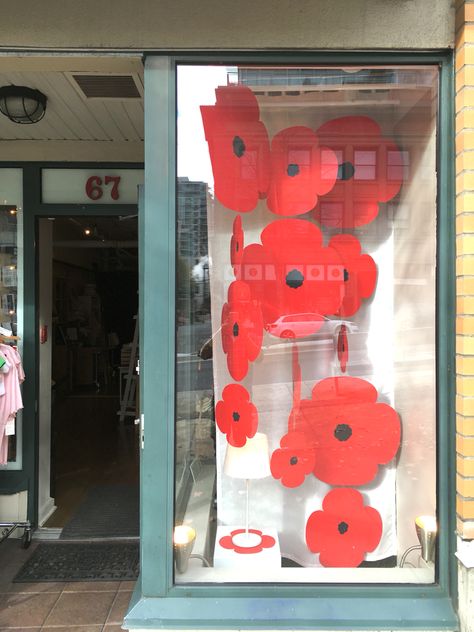 Rememberance Day Window Display with Poppies Rememberance Ideas, Knitted Poppies, Remembrance Day Art, Remembrance Day Poppy, Store Window Display, Store Window Displays, Winter Window, Poppy Art, Flower Window