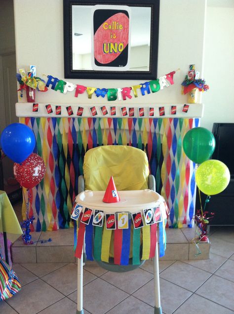 Uno themed decor, shows high chair decor idea and backdrop great for pics, Callie is uno card is half of poster board size and made to look like uno card! This was big whole set up was big hit with guests Uno Card Decorations, Uno Decorations, Uno Backdrop, Diy Uno Party Decorations, Uno Birthday, Uno Party, Uno Decorations Ideas, Uno Party Decorations, Uno Birthday Party