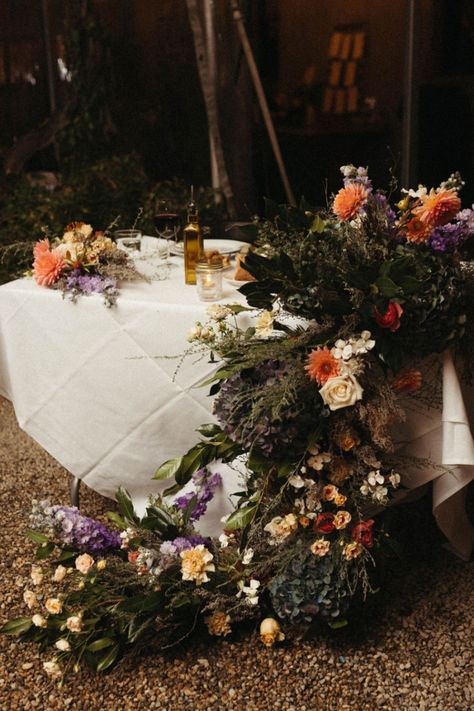 Moody Florals for Wedding Tables: Create a Dramatic and Elegant Setting 🌹🌙  Transform your wedding tables with moody, rich floral arrangements. Embrace deep hues and lush textures to set a dramatic and sophisticated tone for your celebration. Jewel Tone Floral Arrangements, Moody Spring Wedding, Florals For Wedding, Moody Florals, Pagan Wedding, Romantic Wedding Flowers, January Wedding, Ball Wedding, Dinner Party Table