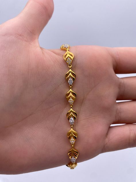 A Beautiful & Dainty 22ct / 22K Yellow Gold & Cubic Zirconia (CZ) Fancy Bracelet Metal : 22K Gold 916 Gold Weight : 9.2 GramsLength : 7 inch Width : 6.0 mm Packaging : Elegant Box Shipping Free in UK Shipping World Wide : See Policy Payment : PayPal, Credit Card, Bank Transfer Returns Policy : 14 Days Hassle Free Returns for 100% Refund To try this item Or View More from our collections Please Visit Our Showroom at North west London . Bracelets Gold Design For Women, Gold Bracelet Simple Design, Good Bracelets For Women, Elegant Gold Bracelet Simple, Braslate Design For Women, Women Bracelets Gold Designs, Bracelets Designs For Women, Chain Bracelets Gold Simple For Women, Ladies Bracelets Gold Indian