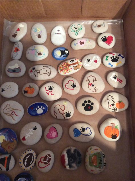 Painted rocks with dog paw print theme.  2017 kindness project. Dog Painted Rocks Easy, Pet Memorial Painted Rocks, Painted Rocks Dogs Easy, Paw Print Painted Rocks, Painted Dog Rocks, Dog Painted Rocks Ideas, Dog Rock Painting Ideas, Dog Painted Rocks, Dog Rock Painting